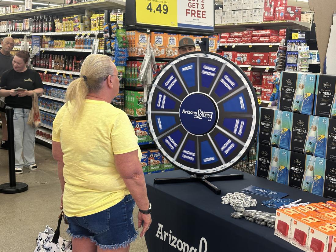 After waiting in line, players spun the the prize wheel for a chance at prize or a spot in the Jumbo Bucks game show.