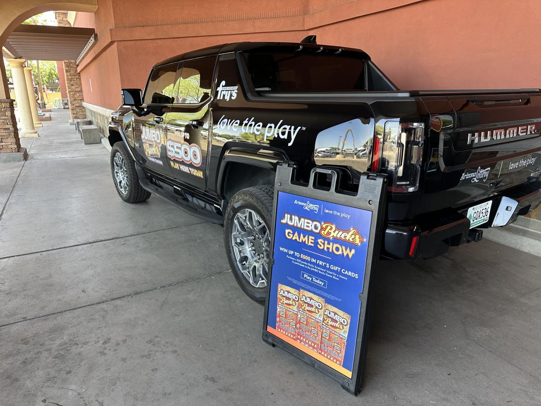 The Hummer and signage greeted shoppers outside Fry’s, alerting them to event.
