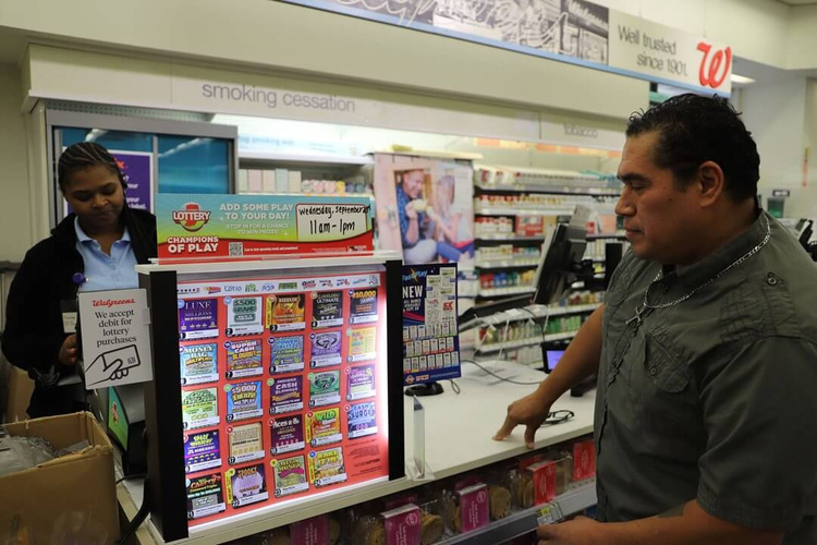 Hoosier Lottery Expands Sales to Walgreens Stores Across Indiana Hoosier Lottery Scratch-offs display at a Walgreens checkout counter.